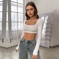 Cropped long sleeve slim fit white ribbed knit top paired with light blue denim jeans - S / White