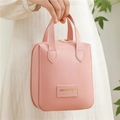 Pink shell-shaped PU leather makeup bag with gold zipper and handle for travel - Pink
