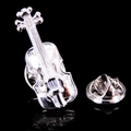 Macro detail of silver violin musical brooch with intricate strings and butterfly clasp back - Silver Violin