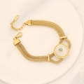 Bracelet multi-rangs en acier doré orné d'un médaillon central en turquoise verte - Style Disque Rond Doré en Nacre (N° 1 Cercle à Mailles)