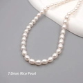 7.0mm white freshwater rice pearl necklace on a minimalist jewelry stand - Seed Beads