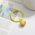 Ginger yellow painted metal bell keychain with a matching color hinge ring accessory - Yellow