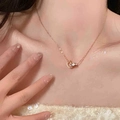 Elegant rose gold titanium necklace featuring a D-letter and crystal-studded ring pendant - Necklace / Rose Gold Letter D Necklace