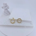Close-up of gold-plated geometric earring connectors with pavé crystals on a stone tray - Gold Micro Pave Round Link