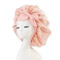 Pink satin hair bonnet with a decorative bow on an elastic wide band for hair protection - Medium Single Layer Ribbon / Apricot