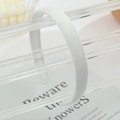 Close-up of white headband with ultra-soft fabric texture and minimalist design - White
