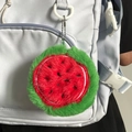 Cute plush watermelon slice coin purse and earphone pouch hanging on a white backpack - Watermelon