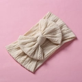 Detailed view of beige cable knit pattern on infant nylon headband with knotted bow - Dirty White