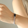 Silver Cuban link bracelet with a rectangular black gemstone accent on a male wrist - Steel Color Black Glass Stone Bracelet