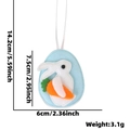 Pendentif lapin de Pâques en feutre bleu avec dimensions 7,5cm et poids de 3,1g - Lapin et Carotte dans un Œuf Bleu