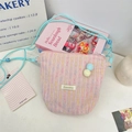 Roze geweven crossbody telefoontas met kleurrijke strepen en schattige pompons - Roze