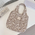 Macro detail of leopard print corduroy tote bag with sozakka beaute label on white desk - Corduroy Leopard Heart Beige