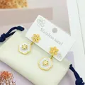 Golden flower earrings in stainless steel with white shell petal accents for women - Earrings