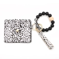 Close-up of leopard print card holder with beaded silicone bracelet and stylish tassel - Spotted Style (3)