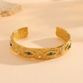 Macro detail of gold hammered cuff bracelet with malachite evil eye and pavé crystals - Gold Evil Eye Hammered Style (G419)
