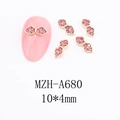 Macro view of gold bow nail charms with pink rhinestones and 10x4mm size detail - A680