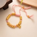 Detail of pink hand-woven lucky bracelet with golden charms and heart pendant - L393-7 Five Emperor Coins Pink