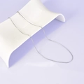 Minimalist silver finish sleek snake bone chain necklace on white ceramic display - Round Snake Chain (L27) - Silver