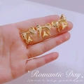 Elegant 14K gold plated bowknot bell earrings jewelry shown on hand with romantic star background - Gold Bowknot Bell Earring Components