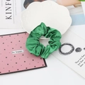 Lustrous green satin hair scrunchie presented on a decorative plate for elegant styling - 10#-Grass Green
