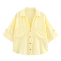 Detail of light yellow linen blend shirt featuring dual chest pockets and wood-like buttons - XS / Yellow