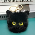 Portachiavi gatto in peluche nera con occhi gialli e moschettone in metallo dorato - Nero