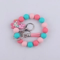 Portachiavi bracciale con perline di silicone, ciondolo sirena rosa e nappina alla moda - Rosa