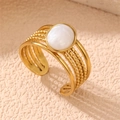 Golden multi-layer open ring featuring a white oval shell stone and textured beaded bands - Mother of Pearl Multi-layer (RS0020yuanxing)