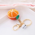 Handmade crochet orange fruit keychain with golden metal ring and a small white bell - Fruit Style-Orange
