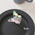 Macro detail of a 5cm laser iridescent butterfly hair claw clip on a sleek black tray - 12# Butterfly-5cm