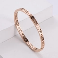 Minimalist rose gold titanium steel bracelet with Greek key pattern in hollow design - Rose Gold