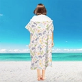 Pink microfiber hooded beach poncho with unicorn floral print worn on a sunny beach - Pullover Style - Purple Unicorn