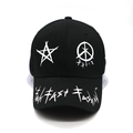 Black street style baseball cap with white graffiti star and metal ring accents - M (56-58cm) / Black