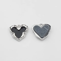 Detail of silver heart-shaped alloy pendants with black and blue textured enamel centers - Black-Silver