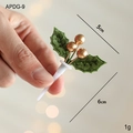 Christmas cake topper featuring green fabric leaves and gold berries decoration - Gold Berry Style