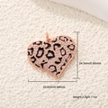 Macro view of leopard print heart pendant with dimensions 24.3mm by 23.8mm - Rose Gold Leopard Heart