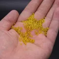 Handheld view of 2/3/4mm translucent yellow glass seed beads for DIY jewelry making - 2mm / 15g / Gold Yellow
