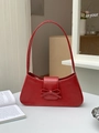 Elegant red baguette shoulder bag with stylish bow accent and smooth leather finish - Red