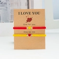 Handmade woven couple bracelets with red and yellow heart pendants on card - Red & Yellow - Set of 2