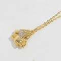 Gold glove pendant necklace featuring sparkling rhinestones and delicate gold chain - Hands