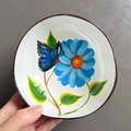 Handcrafted coconut shell bowl with hand-painted blue butterfly and floral pattern inside - Butterfly and Flower