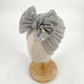 Grey pleated baby turban hat with a large gold polka dot mesh bow for newborn girls - Gray