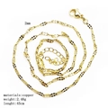 Detail view of 2mm golden copper link chain showing flat rings and spiral layout - Basic Chain