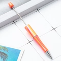DIY beaded ballpoint pen with orange-pink gradient UV finish and metallic silver hardware - Fluorescent Orange Gradient