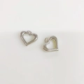 Macro shot of silver hollow heart-shaped charms with polished metal surface and ring loop - Silver Hammered Hollow Heart (ZYN-DMK754P)