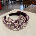 Luxuriöser lila Stirnband mit glitzernden Strasssteinen und Kristallbogen-Details - Lila