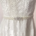 Women's white pearl elastic belt featuring three silver rhinestone heart buckles - Silver Heart Linked Buckle (KL139-29)