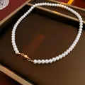 Single layer white pearl necklace with gold magnetic clasp on brown leather case - 6mm / White