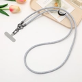 Macro shot of grey woven phone lanyard with metal clip and T-shaped anchor patch - Light Blue