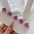 Detailed view of 5-piece set of purple resin flower hair clips with sparkling rhinestones - 5 Pieces / Purple